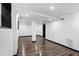 Large basement area with modern flooring, recessed lighting, and white walls at 3661 W Potomac Dr, East Point, GA 30344