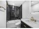 Contemporary bathroom featuring a black tiled shower and elegant marble sink at 3661 W Potomac Dr, East Point, GA 30344