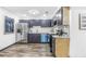Contemporary kitchen with stainless steel appliances, modern cabinets, and light countertops at 3661 W Potomac Dr, East Point, GA 30344