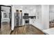Charming kitchen featuring stainless steel appliances, white cabinets and an open view to the bedroom at 3661 W Potomac Dr, East Point, GA 30344