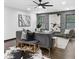 Comfortable living room with gray walls, hardwood floors, modern design, and plentiful natural light at 3661 W Potomac Dr, East Point, GA 30344