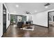 Spacious living room with hardwood floors, gray accent wall, modern design, and plentiful natural light at 3661 W Potomac Dr, East Point, GA 30344