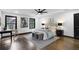 Bright main bedroom with dark trim, wood floors, ceiling fan, and stylish modern design at 3661 W Potomac Dr, East Point, GA 30344