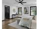 Bright bedroom with dark trim windows, desk and chair, plush rug, and modern decor at 3661 W Potomac Dr, East Point, GA 30344