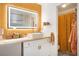Attractive bathroom featuring a vanity with lighted mirror and adjacent shower with golden shower curtain at 105 Park Ridge Cir, Marietta, GA 30068