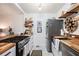 Bright kitchen with white cabinets, butcher block countertops, and stainless steel appliances, creating a functional space at 105 Park Ridge Cir, Marietta, GA 30068