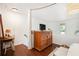 Cozy loft area with hardwood floors, a vintage dresser, and a desk for a versatile space at 105 Park Ridge Cir, Marietta, GA 30068