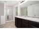 Bathroom featuring double sinks with granite countertops and a separate shower stall at 3095 Bonnes Dr, Lithonia, GA 30038