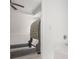 View into a bedroom from an en-suite bath showcasing a decorative headboard and tray ceiling at 3095 Bonnes Dr, Lithonia, GA 30038