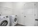 Neat laundry room featuring modern washer and dryer units with a clean, white interior at 3095 Bonnes Dr, Lithonia, GA 30038