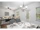 Open concept living room and dining area featuring hardwood floors and lots of natural light at 3095 Bonnes Dr, Lithonia, GA 30038
