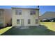 Well-maintained backyard with a grassy lawn and a small concrete patio at 3108 Broadleaf Trl, Fairburn, GA 30213
