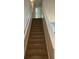 Carpeted staircase leading to the upper level of the home at 3108 Broadleaf Trl, Fairburn, GA 30213