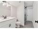 Bathroom with shower, granite countertops, modern sink and cabinet at 682 Shelton Sw Ave, Atlanta, GA 30310