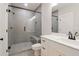 Modern bathroom with a glass-enclosed shower featuring stylish tile and a convenient built-in bench at 682 Shelton Sw Ave, Atlanta, GA 30310