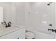 Bright bathroom featuring white subway tiles, a sleek vanity, and modern fixtures at 682 Shelton Sw Ave, Atlanta, GA 30310