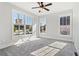 Bright bedroom with large windows letting in natural light and soft gray carpet flooring at 682 Shelton Sw Ave, Atlanta, GA 30310