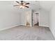 Spacious bedroom with neutral tones, carpeted flooring, open to the bathroom and hallway entrances at 682 Shelton Sw Ave, Atlanta, GA 30310