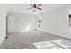 Large bedroom features plush carpet, ceiling fan, and lots of natural light at 682 Shelton Sw Ave, Atlanta, GA 30310