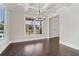 Bright dining area features a modern light fixture, large windows, and seamless flow at 682 Shelton Sw Ave, Atlanta, GA 30310