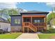 Charming home with a covered porch and brick foundation in a residential neighborhood at 682 Shelton Sw Ave, Atlanta, GA 30310