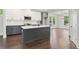 Bright kitchen with gray cabinets, stainless steel appliances and island at 682 Shelton Sw Ave, Atlanta, GA 30310