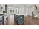 Open floor plan showcasing kitchen with island, stainless appliances, and breakfast bar at 682 Shelton Sw Ave, Atlanta, GA 30310