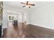 Open-concept living area with hardwood floors flowing into the kitchen provides seamless living at 682 Shelton Sw Ave, Atlanta, GA 30310