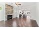 Open-concept space showcasing a stone fireplace and seamless flow into the modern kitchen at 682 Shelton Sw Ave, Atlanta, GA 30310