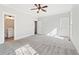 Unfurnished main bedroom featuring plush carpet, ceiling fan, and ensuite bathroom at 682 Shelton Sw Ave, Atlanta, GA 30310