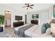 Spacious main bedroom features plush carpet, ceiling fan, and ensuite bathroom at 682 Shelton Sw Ave, Atlanta, GA 30310