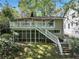Two-story home with a private, screened-in porch, wooden deck, and a stairway down to the yard at 2585 Acorn Ne Ave, Atlanta, GA 30305