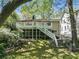 Two-story home with a private, screened-in porch, wooden deck, and a stairway down to the yard at 2585 Acorn Ne Ave, Atlanta, GA 30305