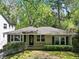 Charming single-story home with fresh landscaping and a manicured lawn in a serene, tree-lined neighborhood at 2585 Acorn Ne Ave, Atlanta, GA 30305