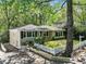 Charming single-story home with fresh landscaping and a white picket fence in a serene, tree-lined neighborhood at 2585 Acorn Ne Ave, Atlanta, GA 30305