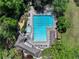 Overhead view of a pool with lap lanes, a hot tub, a pool house, and several lounge chairs at 2585 Acorn Ne Ave, Atlanta, GA 30305