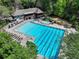 Aerial view of a stunning pool area with lap lanes, recreational swimming area, and a large pool house at 2585 Acorn Ne Ave, Atlanta, GA 30305