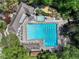 Overhead view of a pool with lap lanes, a hot tub, a pool house, and several lounge chairs at 2585 Acorn Ne Ave, Atlanta, GA 30305