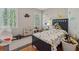 ' bedroom with a dinosaur theme, featuring two bright windows and plenty of soft toys at 3362 Timber Rdg, Powder Springs, GA 30127