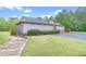 Well maintained commercial building exterior with grass lawn and wood pathway at 3362 Timber Rdg, Powder Springs, GA 30127