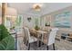 Elegant dining room boasts a large table, comfortable seating, and decorative lighting at 3362 Timber Rdg, Powder Springs, GA 30127