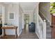 Inviting entryway with hardwood floors, staircase and access to the living and dining areas at 3362 Timber Rdg, Powder Springs, GA 30127