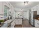 Spacious kitchen featuring stainless appliances, dark counters, and an eat-in area with a view at 3362 Timber Rdg, Powder Springs, GA 30127