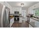 Spacious kitchen featuring stainless steel appliances, dark counters, and plenty of storage at 3362 Timber Rdg, Powder Springs, GA 30127