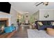 Open-concept living room and dining area featuring a fireplace and seamless flow at 3362 Timber Rdg, Powder Springs, GA 30127