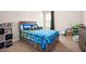 Bedroom featuring a unique Fortnite themed bed and modern shelving with plenty of storage at 6150 Birchfield Trl, Cumming, GA 30041