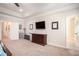 Spacious main bedroom with ceiling fan, white trim, and multiple doorways at 6150 Birchfield Trl, Cumming, GA 30041