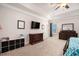 Spacious main bedroom with ceiling fan, large window and dark wood furniture at 6150 Birchfield Trl, Cumming, GA 30041