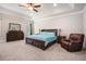 Spacious main bedroom with tray ceiling, ceiling fan, and dark wood furniture at 6150 Birchfield Trl, Cumming, GA 30041