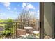 Cozy balcony with seating offers a relaxing outdoor retreat with views of lush greenery and blue skies at 711 Cosmopolitan Ne Dr # 347, Atlanta, GA 30324